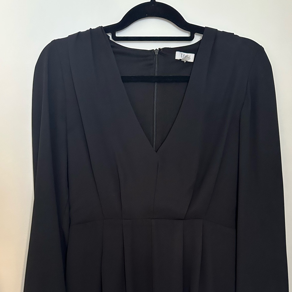 Black long sleeved romper with v neck and sheer sleeves